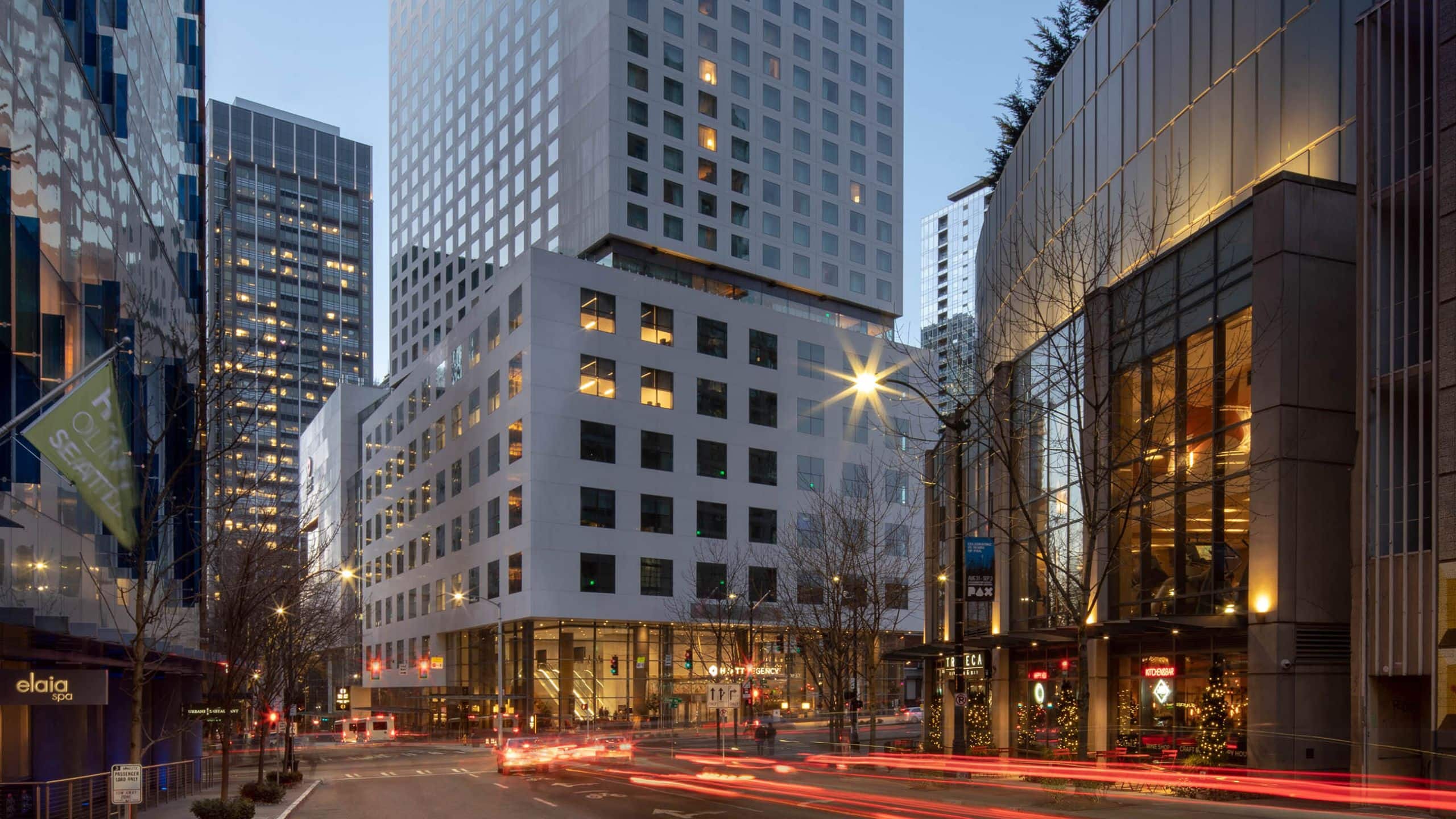 Actual Hyatt Regency Seattle exterior at dusk.
